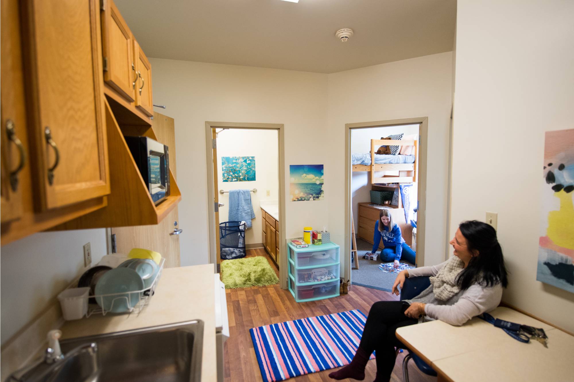 Image of students in a 2 bedroom apartment style room